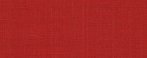 Poster - A textured fabric in a warm, muted red hue, exhibiting fine, woven patterns that create an inviting and cozy appearance.