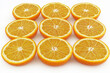 © whitestorm - A vibrant display of sliced oranges arranged in a grid pattern against a plain white background, highlighting their juicy texture and bright color, healthy lifestyle.