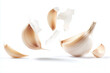 © Marut - Garlic cloves with smooth papery skin floating against white background, showcasing their natural beauty and texture. This captures essence of fresh garlic