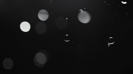Poster - Raindrop Elegance: Artful close-up of raindrops and bokeh lights, captured against a dark backdrop, evokes a sense of serenity and abstract beauty.