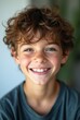 © Michael - Smiling teenage boy with curly hair in studio