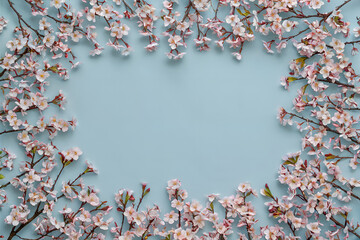 Fototapete - Flatlay image of a blue background with flower frame