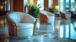 © Dece Std - Luxurious cream leather armchairs in a modern hotel lobby