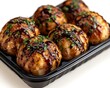 © Bara - Takoyaki balls in takeout tray