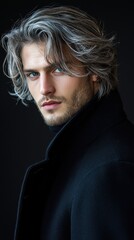 Poster - A man with long hair and a beard is wearing a black coat