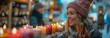 © S photographer - A joyful woman admires colorful candles in a festive marketplace during winter.