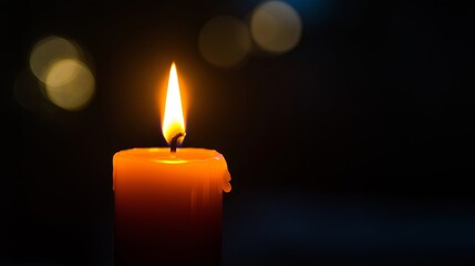 Poster - A tiny candle flame glowing against a jet-black void