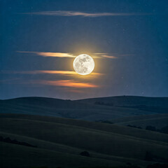 Wall Mural - full moon over the mountains. Full moon rising over hills.
