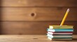 © Kittipat - A stack of colorful books rests on a wooden surface, a pencil subtly leaning against the top volume, suggesting the quiet pursuit of knowledge and learning
