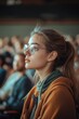 © Goncharenko - Woman with glasses speaking to audience