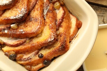 Wall Mural - Freshly baked bread pudding in baking dish on table, top view