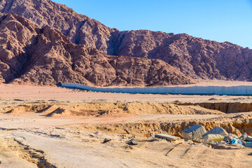 View of the mountains at Sinai peninsula in Egypt. Protective wall around of city Sharm el Sheikh