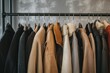 © maxcity - A rack of coats in neutral tones. These garments, ready for cooler weather, offer textures and styles for diverse climates.