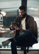 © N F/peopleimages.com - Tablet, research and smile with business man in office for planning, typing and client feedback. Communication, night and email with person in creative agency for web design, virtual advisor and app