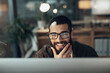© N F/peopleimages.com - Computer, idea and smile with designer man in office at night for website coding or programming deadline. Business, development and thinking with programmer employee in workplace for overtime