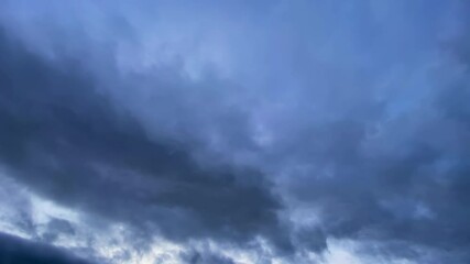 Wall Mural - dark overcast cumulus clouds flowing on sky. nature, weather, air time lapse background