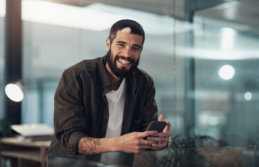Fototapete - Portrait, night and man with smartphone, business and professional with communication. Cellphone, happy employee or consultant with tech, evening or smile with internet, graphic designer or deadline