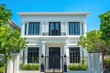 © arif - Classic white house facade on a sunny day, residential property