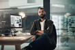 © N F/peopleimages.com - Portrait, computer and arms crossed with business man in office for web designer, research and planning. Homepage layout, professional and creative advisor with person in startup agency at night