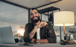 © N F/peopleimages.com - Design, laptop and portrait of programmer man in office at night for coding or computer engineering. Creative, programming and smile with happy employee at desk in workplace for project deadline