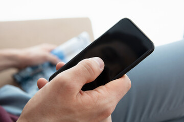 Close up of hand and cell phone