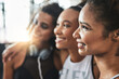 © peopleimages.com - Happy women, fitness or faces with friends at gym for workout, exercise or training together. Female people, profile or smile with huddle in row, unity or solidarity for team challenge at health club