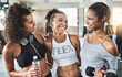 © peopleimages.com - Gym, group and women with friends for hug, fitness and workout together. Weightlifting, exercise and wellness with athlete embrace in health center for class, challenge and happy smile or laugh