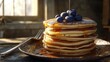 © Stanko - A stack of fluffy golden pancakes with a glossy maple syrup drizzle cascading down the sides