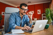 © Miljan Živković - focused concentrated man work on laptop from home office