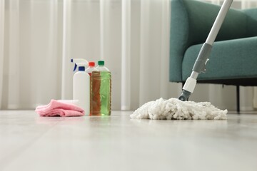 Wall Mural - String mop, cleaning products and supplies on floor indoors