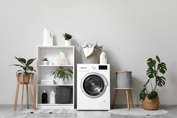 Wall Mural - Washing machine, laundry basket and houseplants in interior of bathroom