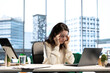 © DC Studio - Stressed overwhelmed business leader working in discomfort with a headache, feeling overburdened and uncomfortable at the office. Female executive deals with anxiety and fatigue.