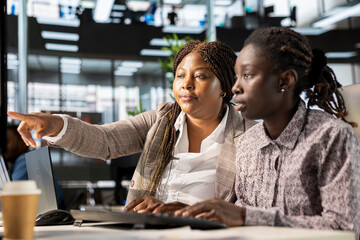 Poster - African american corporate team focuses on data management, planning strategies for company growth and aligning business goals with performance metrics for measurable success.
