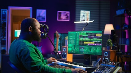 Leinwandbilder - Music composer plays electronic keyboard piano keys and recording new tracks, creating audio recordings before launching music. Artist producer uses synthesizer, post production. Camera B.