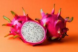 A close up of a red dragon fruit with a black spot on it