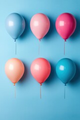 Poster - Pastel Balloons on Light Blue Background in a Flat Lay Arrangement for Party Celebration and Festive Occasions with a Cheerful Mood