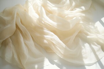 Poster - Elegant ivory fabric draped softly in sunlight creating gentle folds and shadows a serene and calming visual texture for backgrounds and design elements