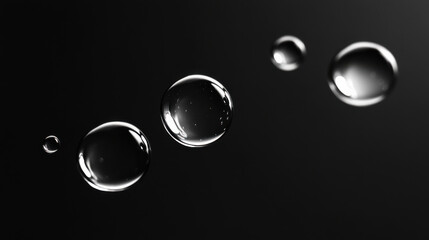 Wall Mural - a set of floating water droplets in varying sizes, illuminated by soft, diffused lighting