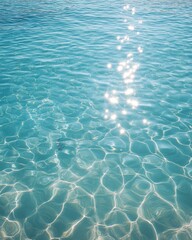 Poster - Serene turquoise water glistens under the sun creating a mesmerizing pattern of light and shadow aquatic beauty