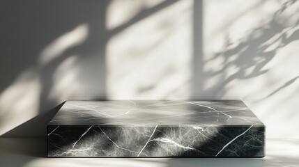 Poster - smooth gray marble tabletop with a soft matte finish, enhanced by delicate shadow overlays on a neutral white wall, creating depth for product displays.