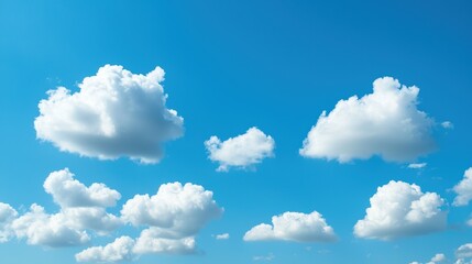 Poster - A bright blue sky dotted with small, puffy white clouds, evoking a sense of peace, tranquility, and a perfect summer day.
