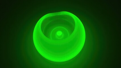 Poster - Uranium Glass. Green light is shining brightly on black surface