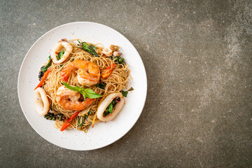 Wall Mural - stir-fried Chinese noodle with basil, chilli, shrimps and squid