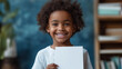 © rabbizz77 - Smiling African American Child Holding Blank Paper