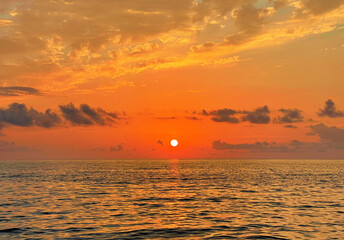Wall Mural - golden sky, cloud and sun with sea beach. atmosphere romantic outdoors scenery background
