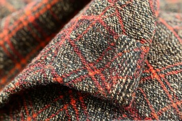 Poster - A close-up of textured plaid fabric, showing its weave detail, red accents, brown hues, and subtle patterns, perfect for backgrounds or design elements.