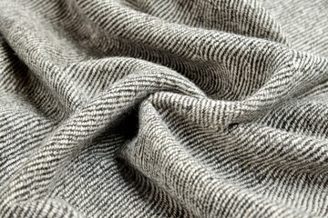 Poster - A detailed macro shot of a luxurious gray and white herringbone wool fabric, emphasizing the intricate weave, texture, and soft, flowing folds, showcasing depth.