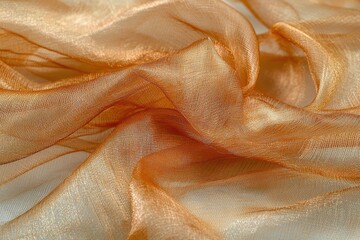 Poster - Close-up of a shimmering golden orange organza fabric, elegantly draped with delicate folds, creating a luxurious and ethereal texture with subtle reflections.