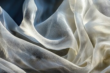 Poster - A delicate, flowing white tulle fabric with an intricate net pattern, softly illuminated to create subtle shadows and graceful folds, perfect for design.
