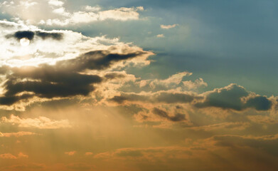 Wall Mural - beautiful and dramatic sunset sky with bright yellow clouds as abstract background